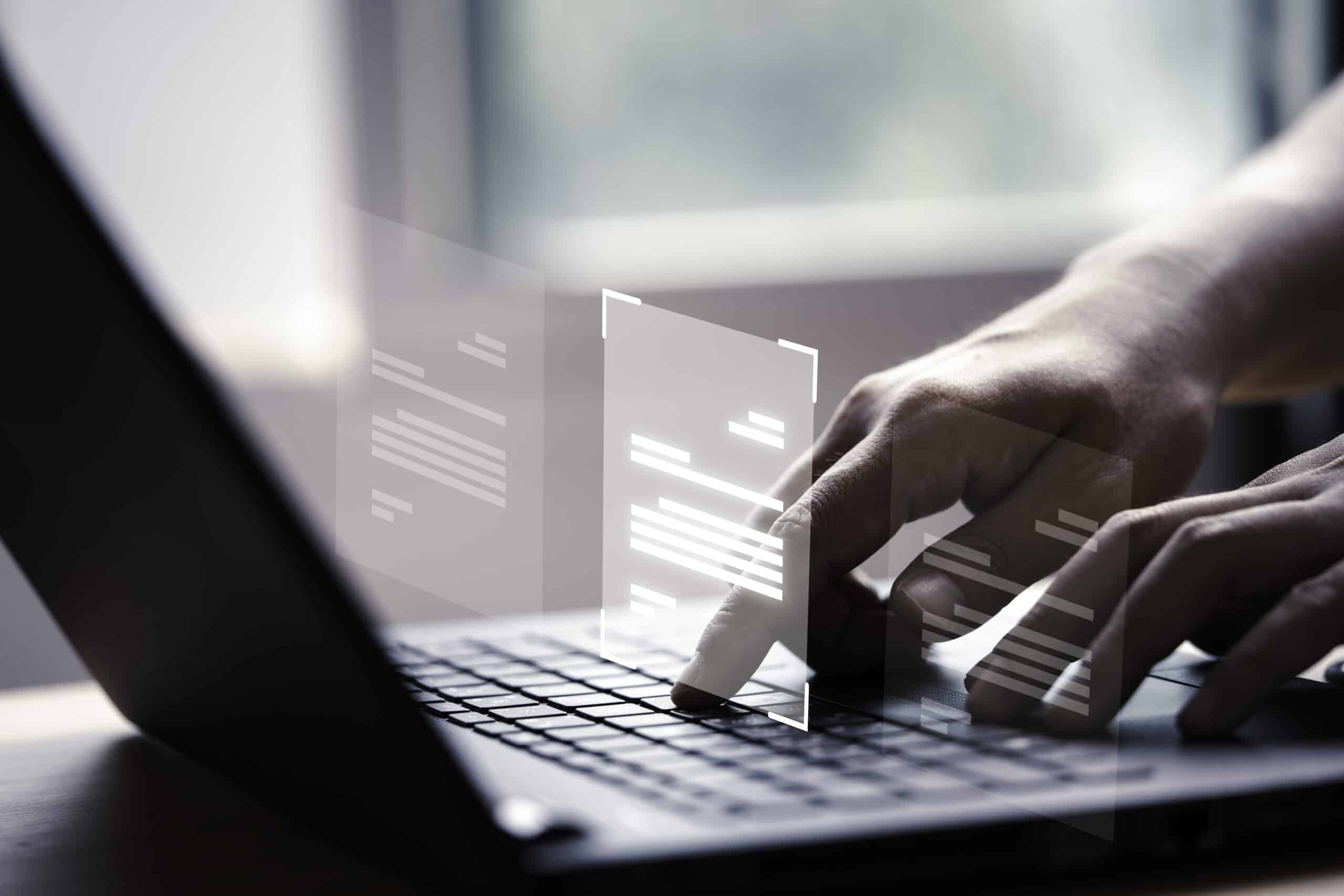 mano usando una computadora portatil con pantalla virtual y documento para aprobar en linea el concepto de gestion de erp y garantia de calidad sin papel scaled